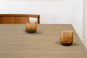 Minimalist dining tabletop featuring a durable NewMika HPL surface.