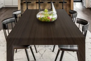 Minimalist dining tabletop featuring a durable NewMika 3287 Fine Walnut SUD HPL surface.