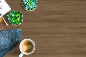 Minimalist dining tabletop featuring a durable NewMika 3335 Plush Wood NOVOL GLOSS HPL surface.